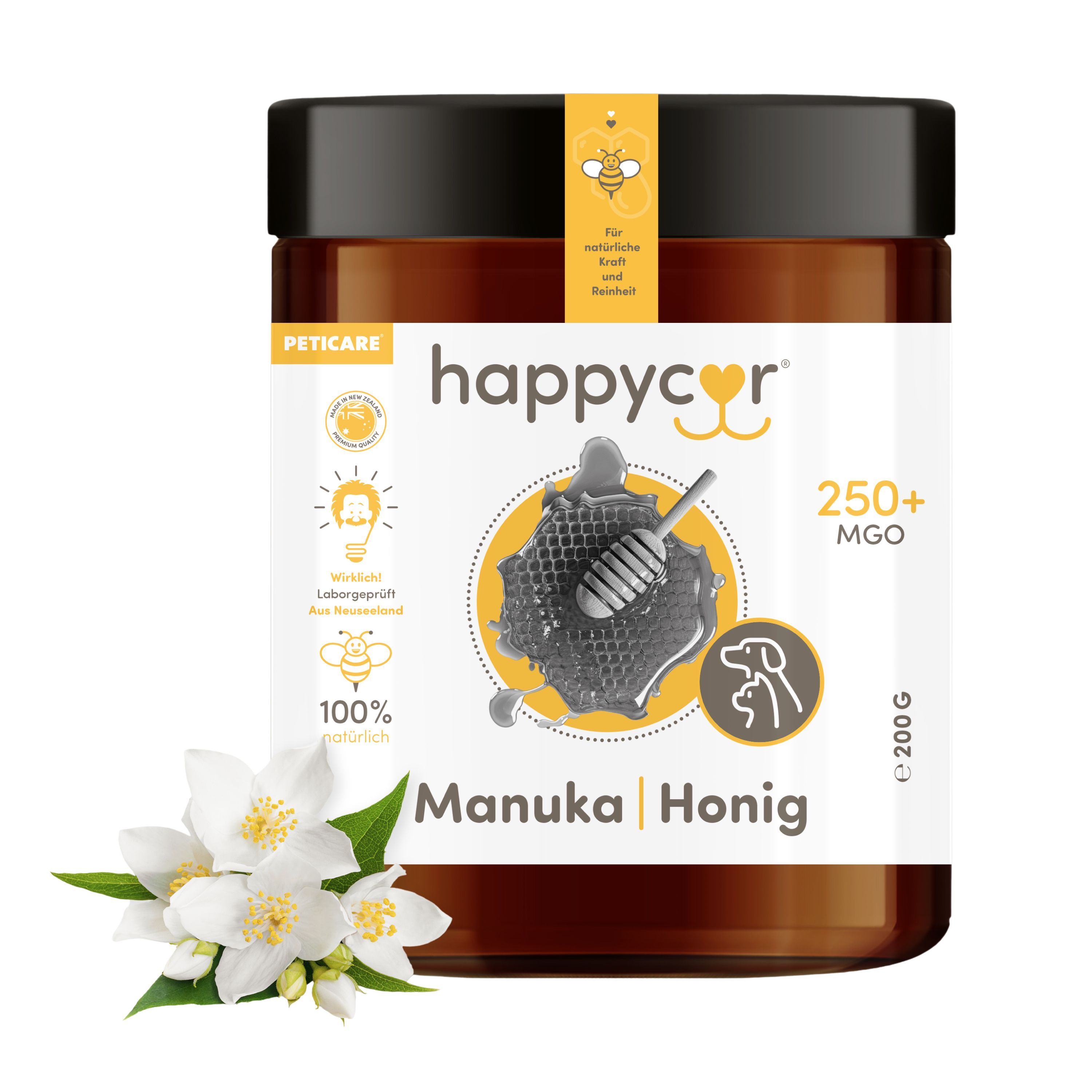 Braunes Glas mit schwarzem Deckel. Aufschrift happycor Manuka Honig MGO 250+. Etikett mit Honigwabe und Bienen. Jasminblüten.