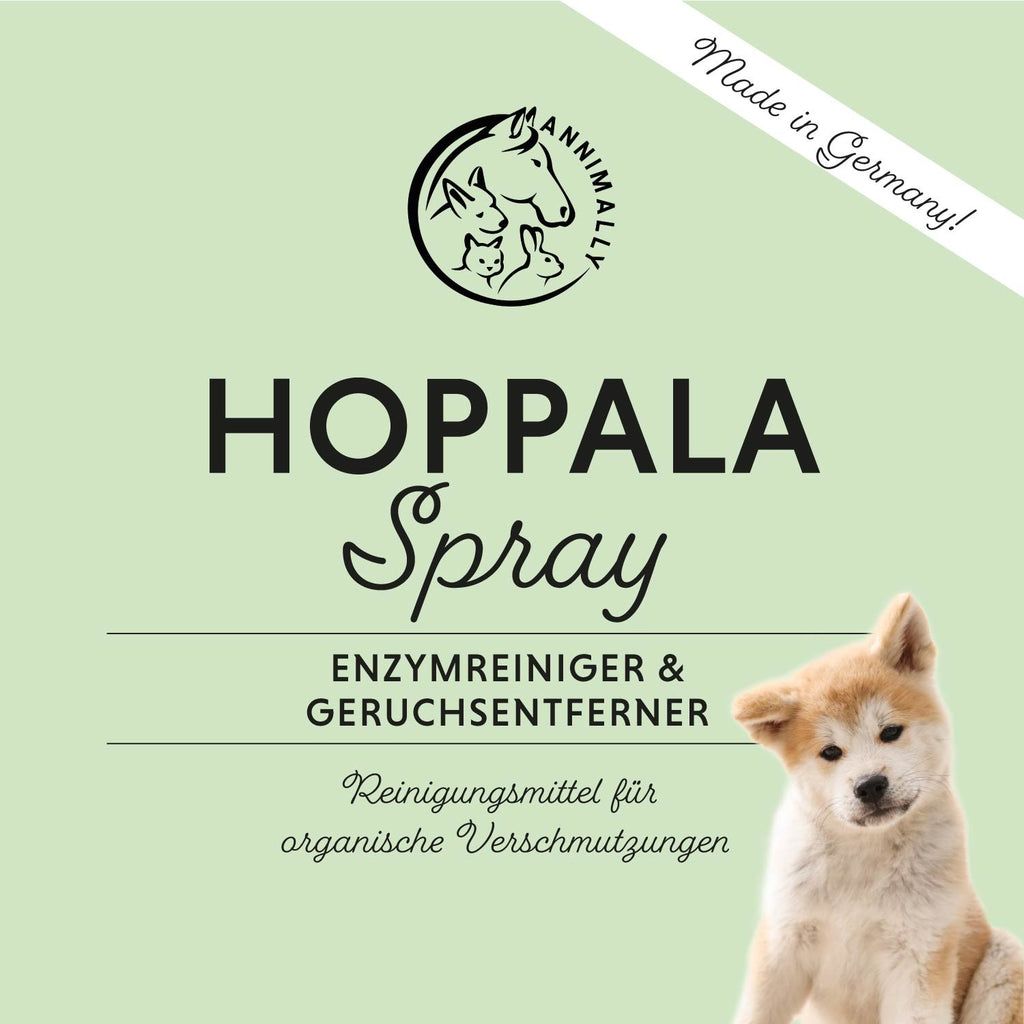 Produktetikett mit Logo und Schriftzug "Hoppala Spray". Ein Hundewelpe ist abgebildet. Text: Enzymreiniger & Geruchsentferner.