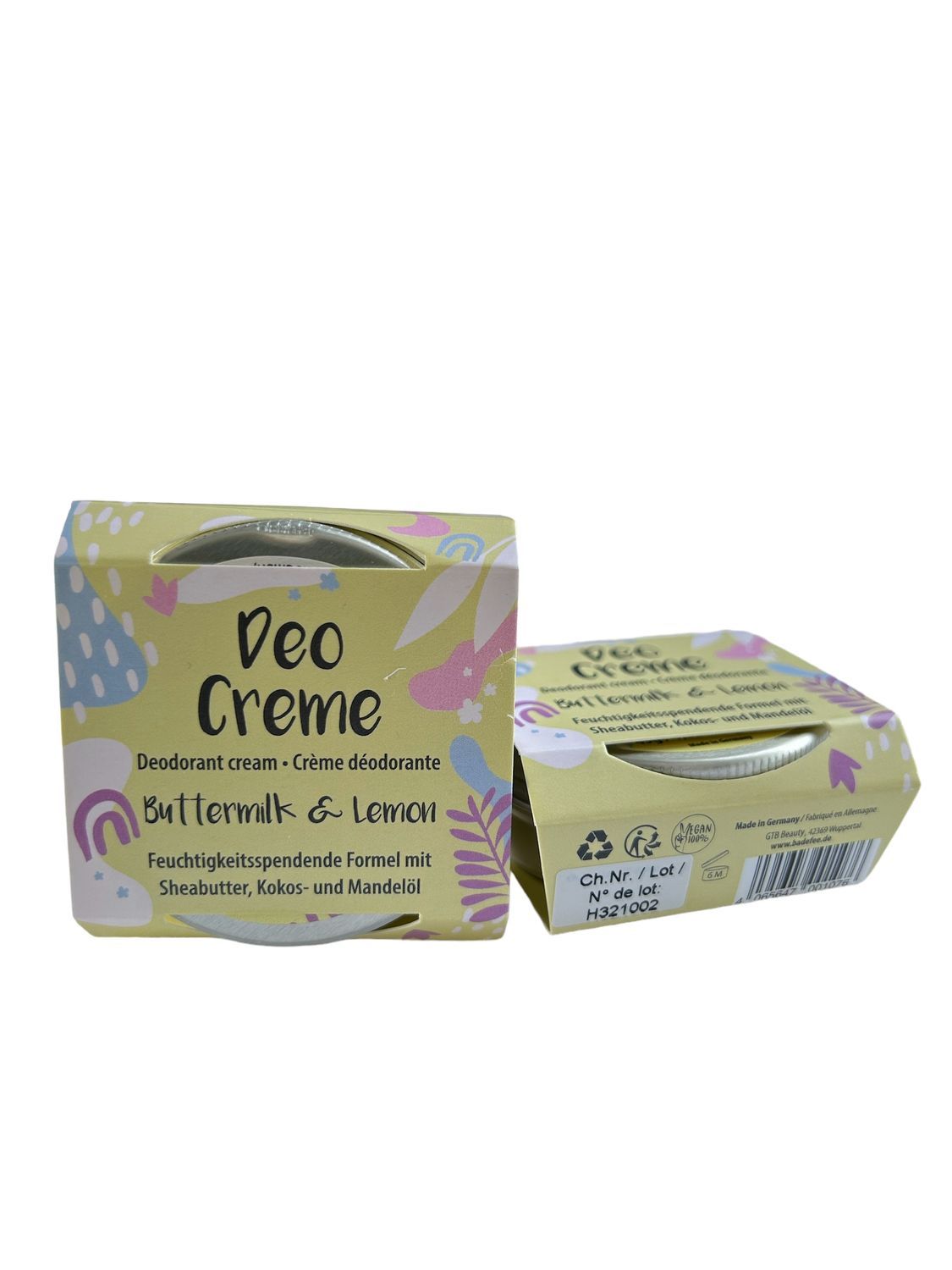 Zwei quadratische Kartons mit Deo Creme. Aufschrift: Buttermilk & Lemon. Verpackung mit floralem Muster und Produktinformationen.