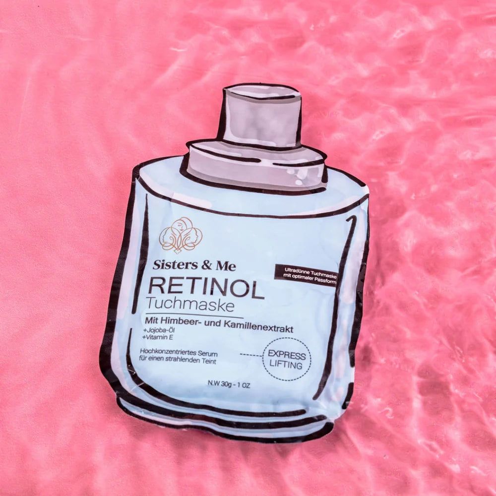 Retinol Tuchmaske auf rosa Stoff. Hellblaue Verpackung mit Produktnamen und Inhaltsstoffen. Grauer Deckel.