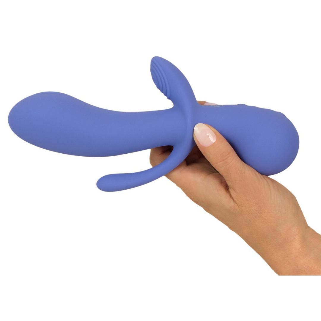 Lila Vibrator, gehalten in einer Hand. Gebogene Form mit zwei Armen. Drei Knöpfe am unteren Ende.