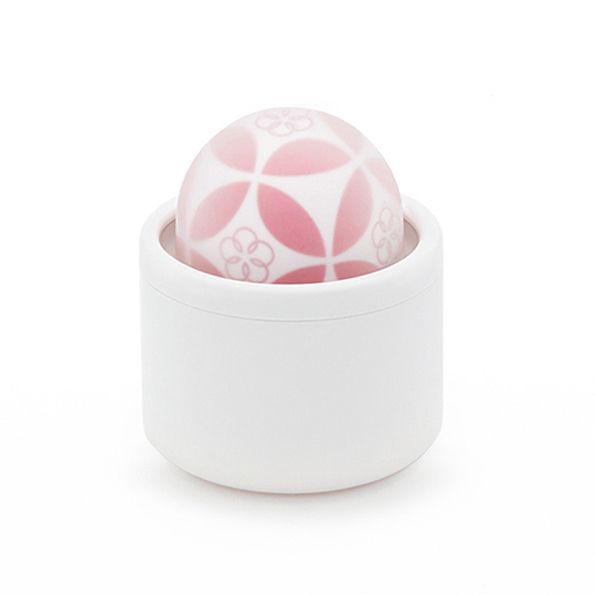 Weißes, zylindrisches Gehäuse mit einer halbkugelförmigen, rosa gemusterten Kugel. Die Kugel hat ein Blumenmuster.