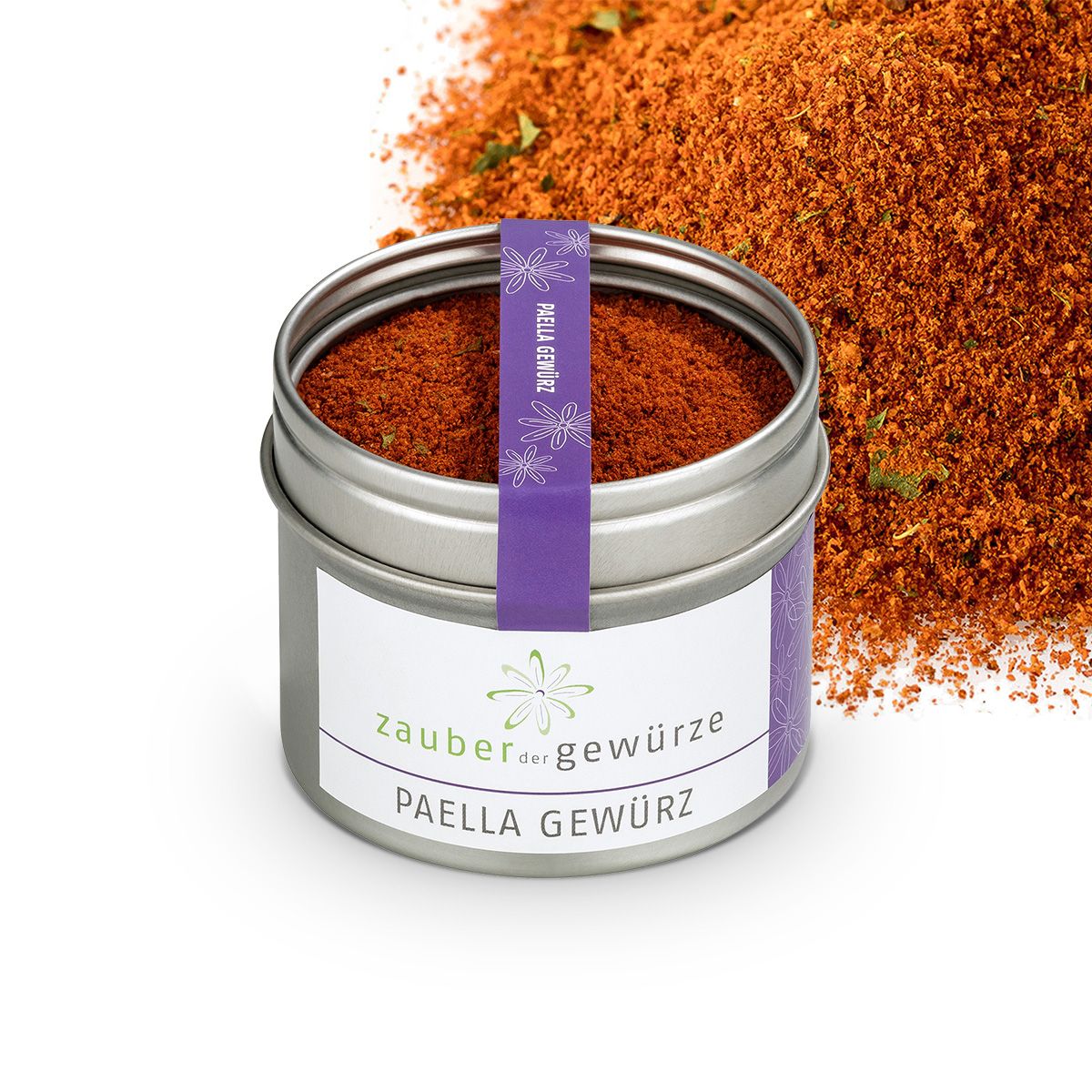 Gewürzmischung in Dose. Dose aus Metall, weißes Etikett mit Schriftzug 'Zauber der Gewürze Paella Gewürz'. Lila Band mit Schriftzug.