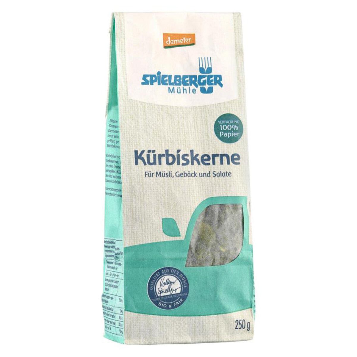 Verpackung mit Kürbiskernen. Aufschrift: Spielberger Mühle, Kürbiskerne, 100% Papier, 250 g. Demeter-Siegel.