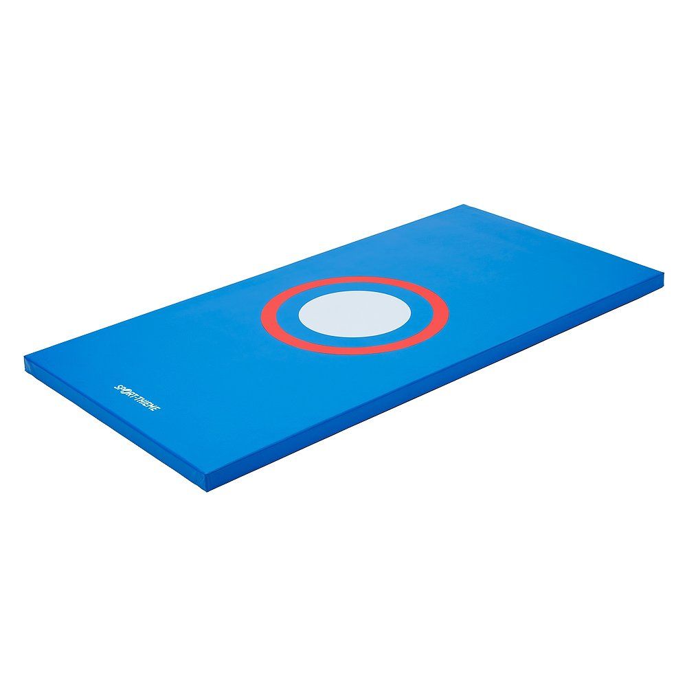 Blaue Turnmatte mit rotem und weißem Zielkreis.