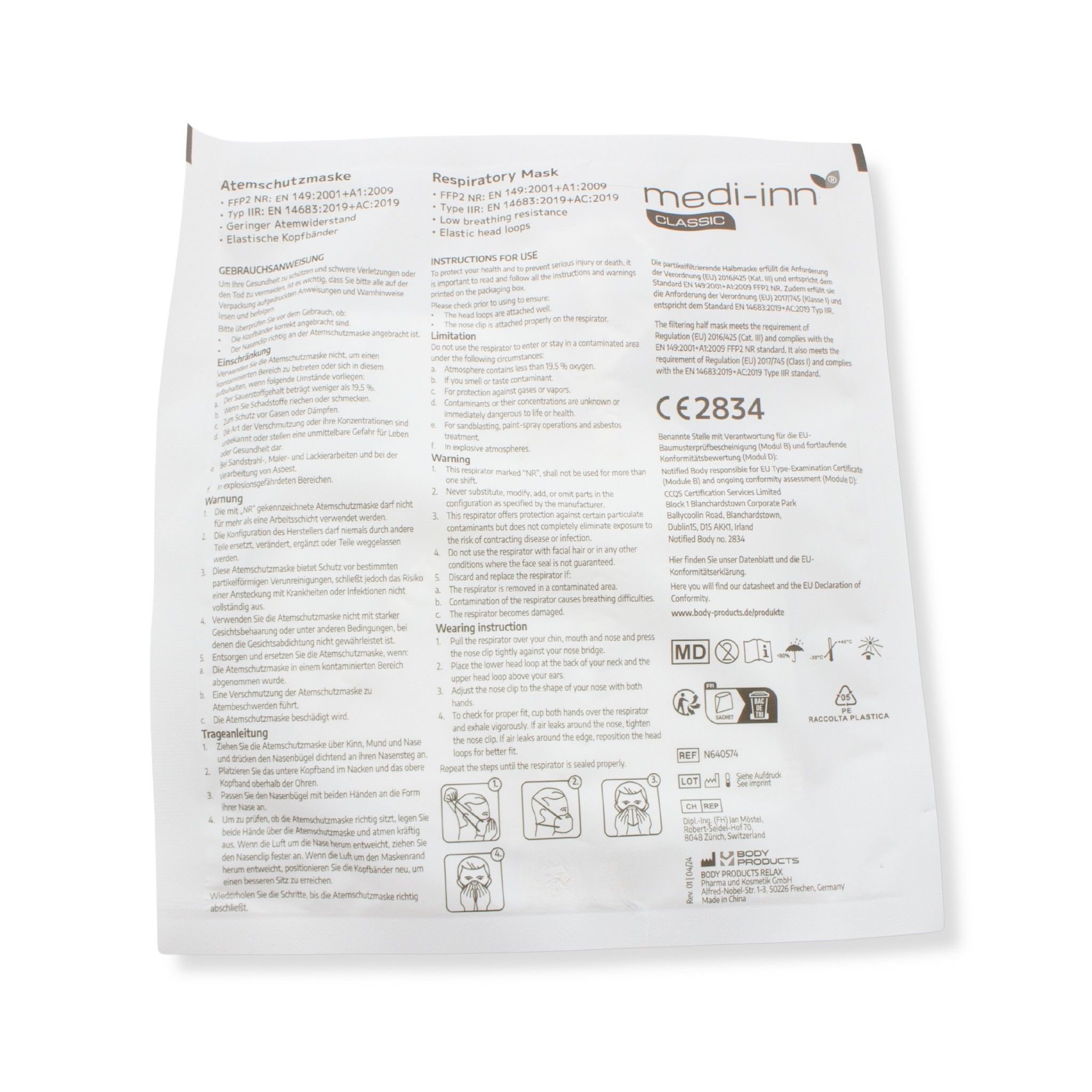 Verpackung mit Informationen zur Atemschutzmaske. Aufschrift: medi-inn, CE 2834. Anweisungen und Piktogramme.