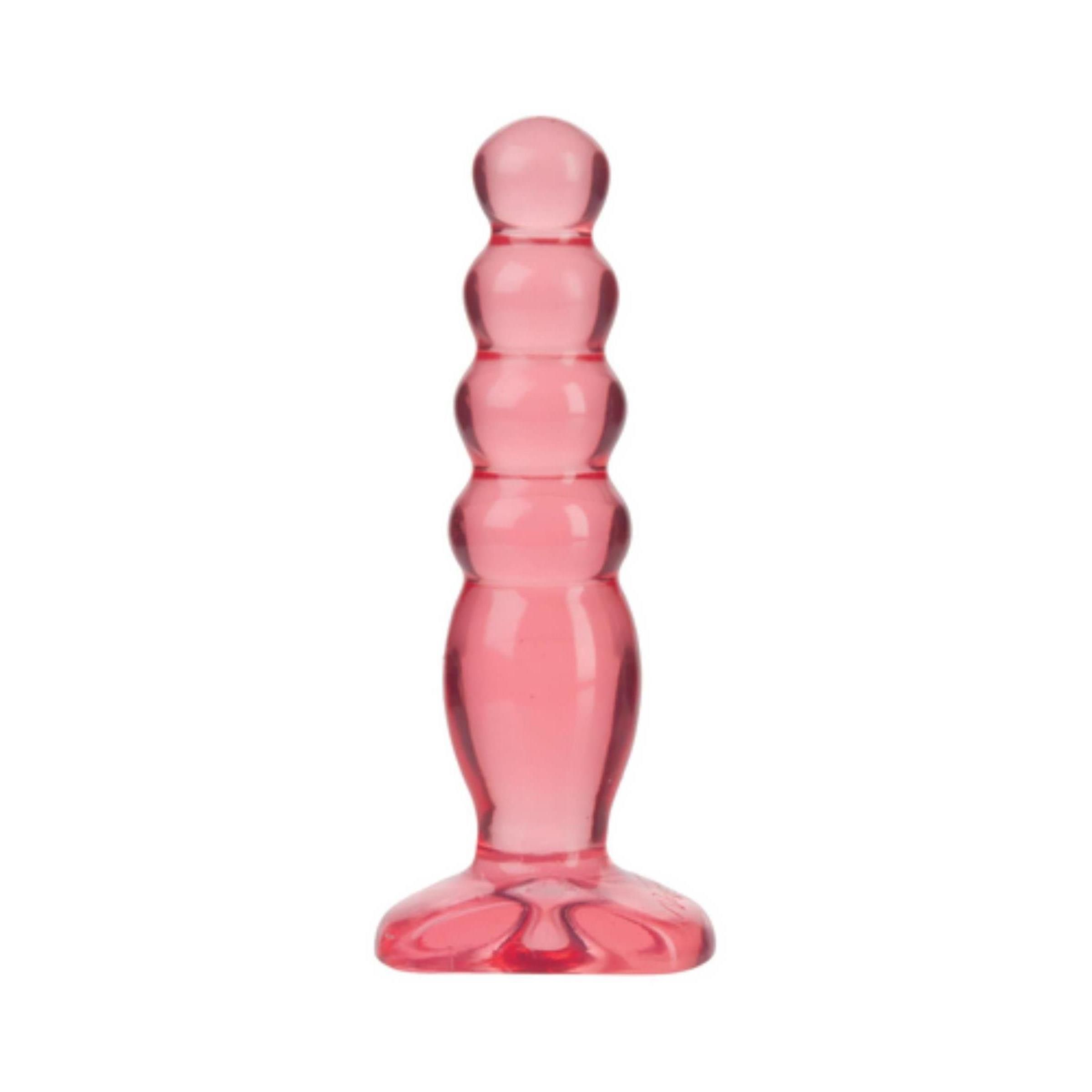 Roter, geriffelter Butt Plug. Klarer Kunststoff. Basis mit Blütenblatt-Design. 5 cm.
