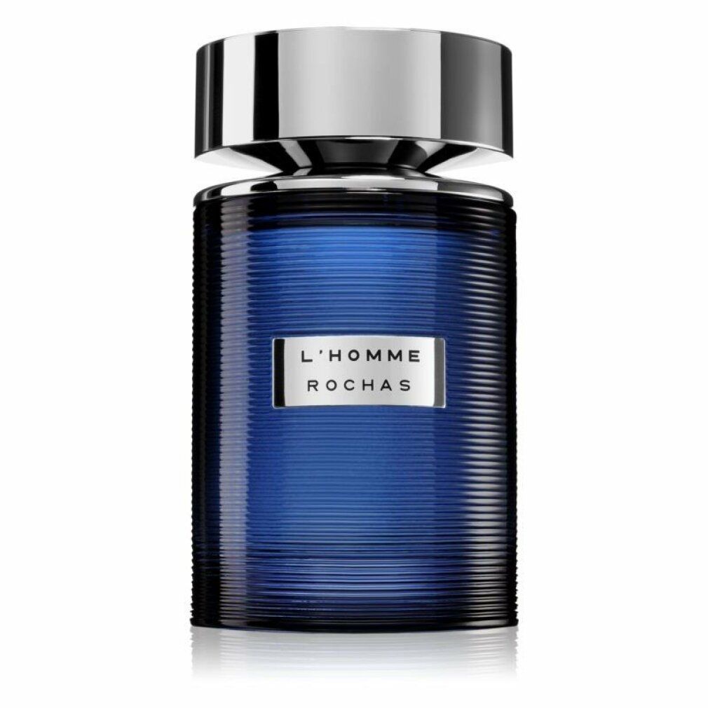 Blauer Flakon mit silbernem Deckel. Aufschrift: L'HOMME ROCHAS. Geriffelte Oberfläche.