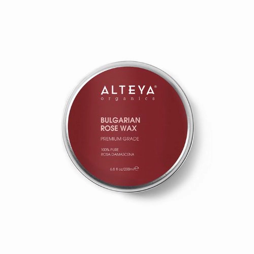 Runde Dose mit rotem Deckel. Aufschrift: Alteya Organics, Bulgarian Rose Wax, Premium Grade.