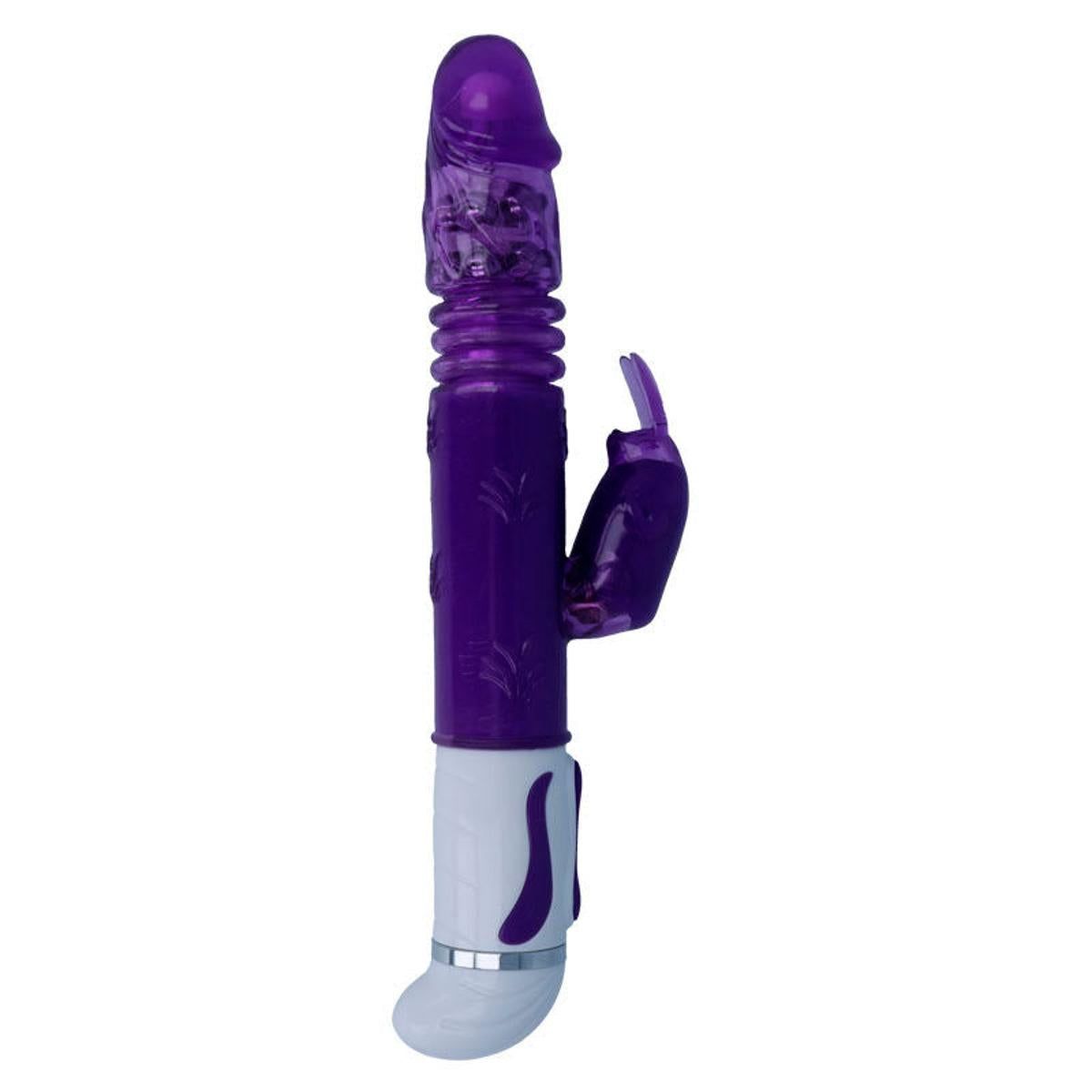 Lila Vibrator mit Hasenohren-Aufsatz. Zylindrischer Schaft, geriffelte Oberfläche. Weißer Sockel mit silbernem Ring.