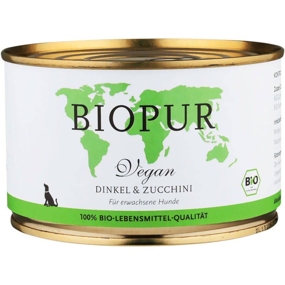Konservendose mit "BIOPUR Vegan Dinkel & Zucchini" für Hunde. Grün-weiße Etikett mit Weltkarte und Bio-Siegel.