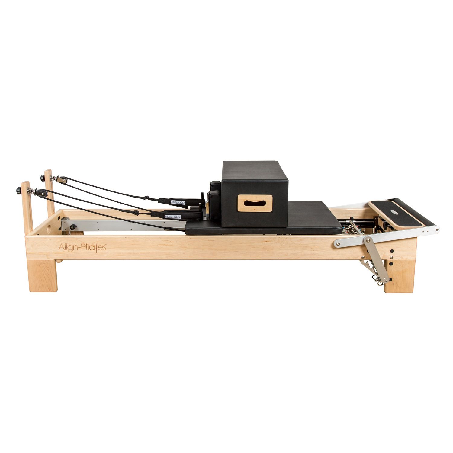 Pilates-Reformer mit Box. Holzrahmen, schwarze Polsterung. Seilzüge und Fußstütze.