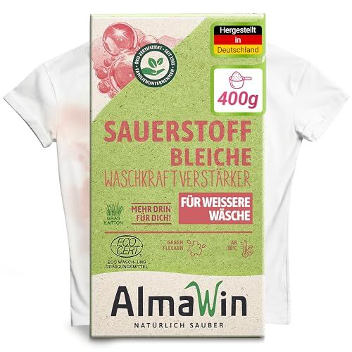 AlmaWin Sauerstoff Bleiche Verpackung vor einem weißen T-Shirt mit Fleck.