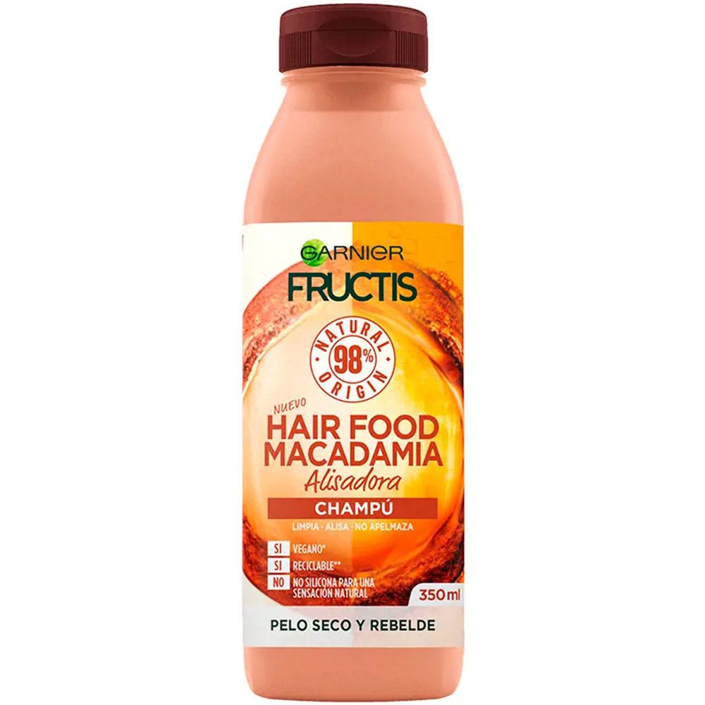Garnier Fructis Hair Food Macadamia Shampoo-Flasche. Rosa Flasche mit braunem Deckel. Etikett mit Produktinformationen.