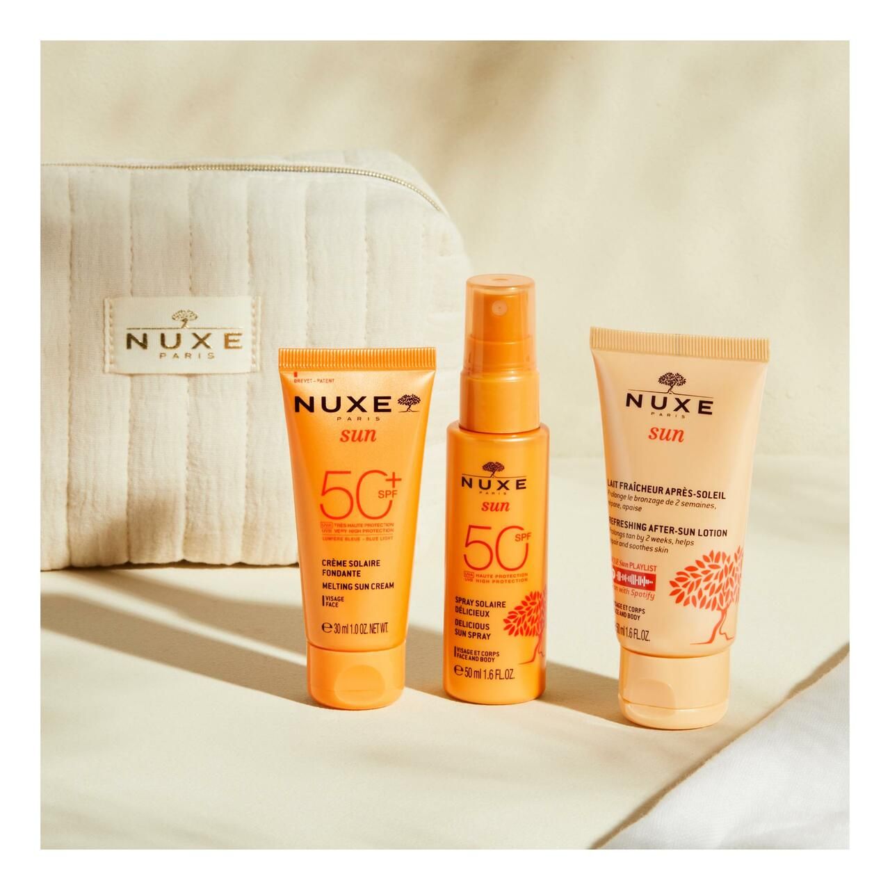 Drei NUXE Sun Sonnenpflegeprodukte. Enthalten Sonnencreme, Sonnenspray und After-Sun-Lotion.