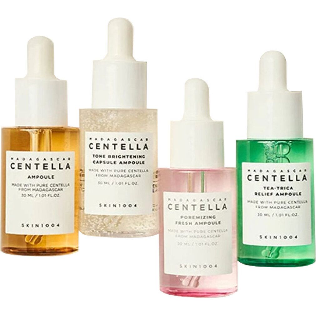 Vier Ampullen von Skin1004 in einer weißen Box: Ampoule, Tone Brightening, Pore-minimizing, Tea-Trica.