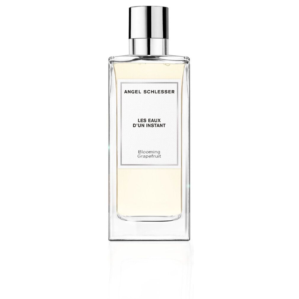 Rechteckige Glasflasche mit silbernem Verschluss. Aufschrift: Angel Schlesser, Les Eaux d'Un Instant, Blooming Grapefruit.