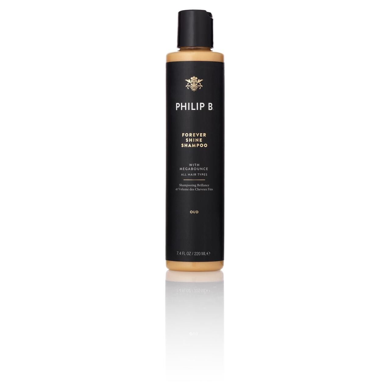 Schwarze Shampoo-Flasche mit schwarzem Deckel. Aufschrift: PHILIP B, Forever Shine Shampoo. Goldfarbenes Etikett mit Text.