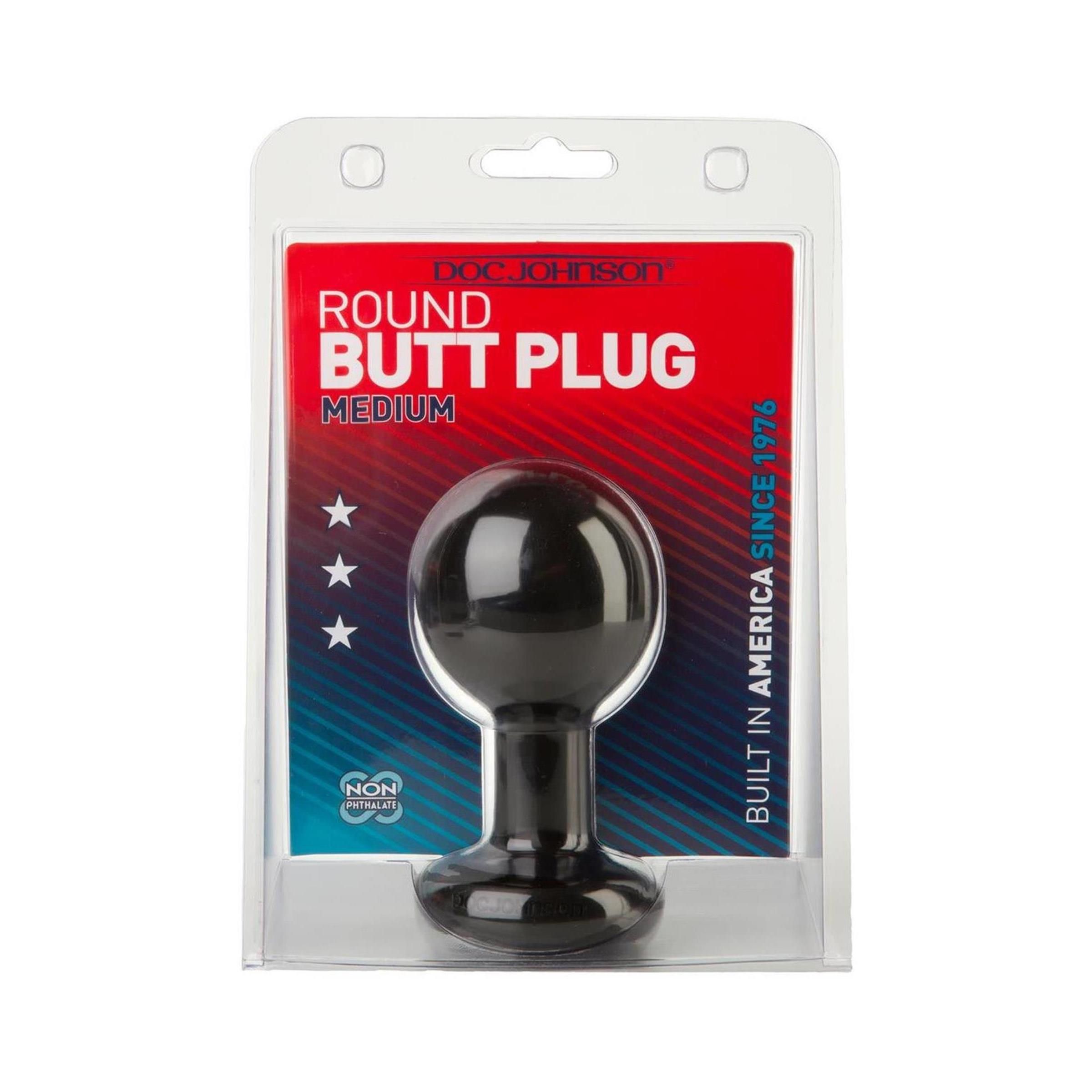 Schwarzer Analplug in Blisterverpackung. Kugelform mit kurzem Schaft und Basis. Text: "ROUND BUTT PLUG", "MEDIUM", "DOC JOHNSON".