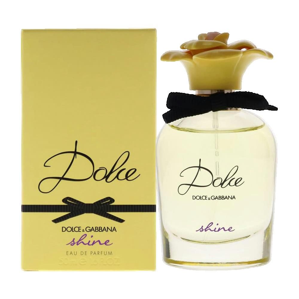 Parfümflasche und Schachtel. Flasche mit gelbem Blütenverschluss und schwarzer Schleife. Aufschrift "Dolce" und "shine".