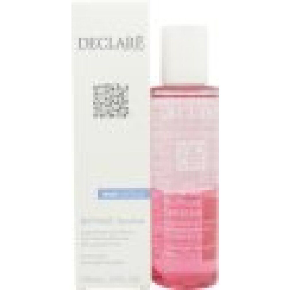 Flasche mit rosa Flüssigkeit und weißem Deckel, neben einer weißen Verpackung.