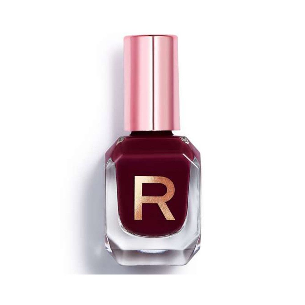 Nagellackflasche mit rosafarbenem Deckel. Die Flasche ist mit dunkelrotem Lack gefüllt und trägt ein goldenes "R".