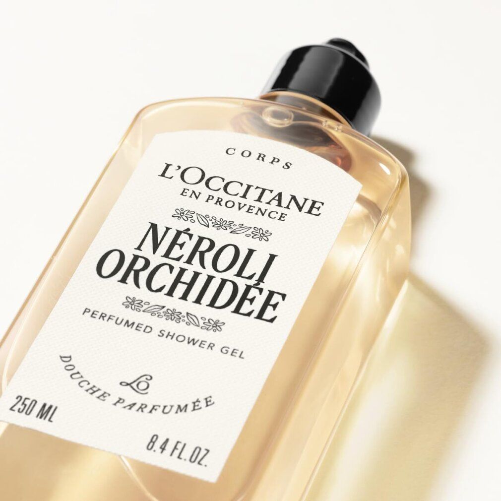 Körper-Duschgel, L'Occitane Néroli Orchidée. Transparente Flasche mit schwarzem Deckel. Produktname und Volumenangabe.