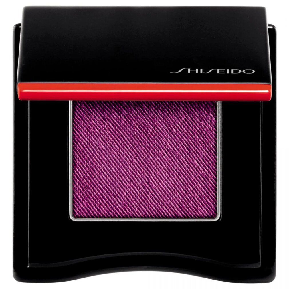 Geöffnete Lidschatten-Palette. Schwarzes Gehäuse mit rotem Akzent. Quadratischer, violetter Lidschatten. Marke Shiseido.
