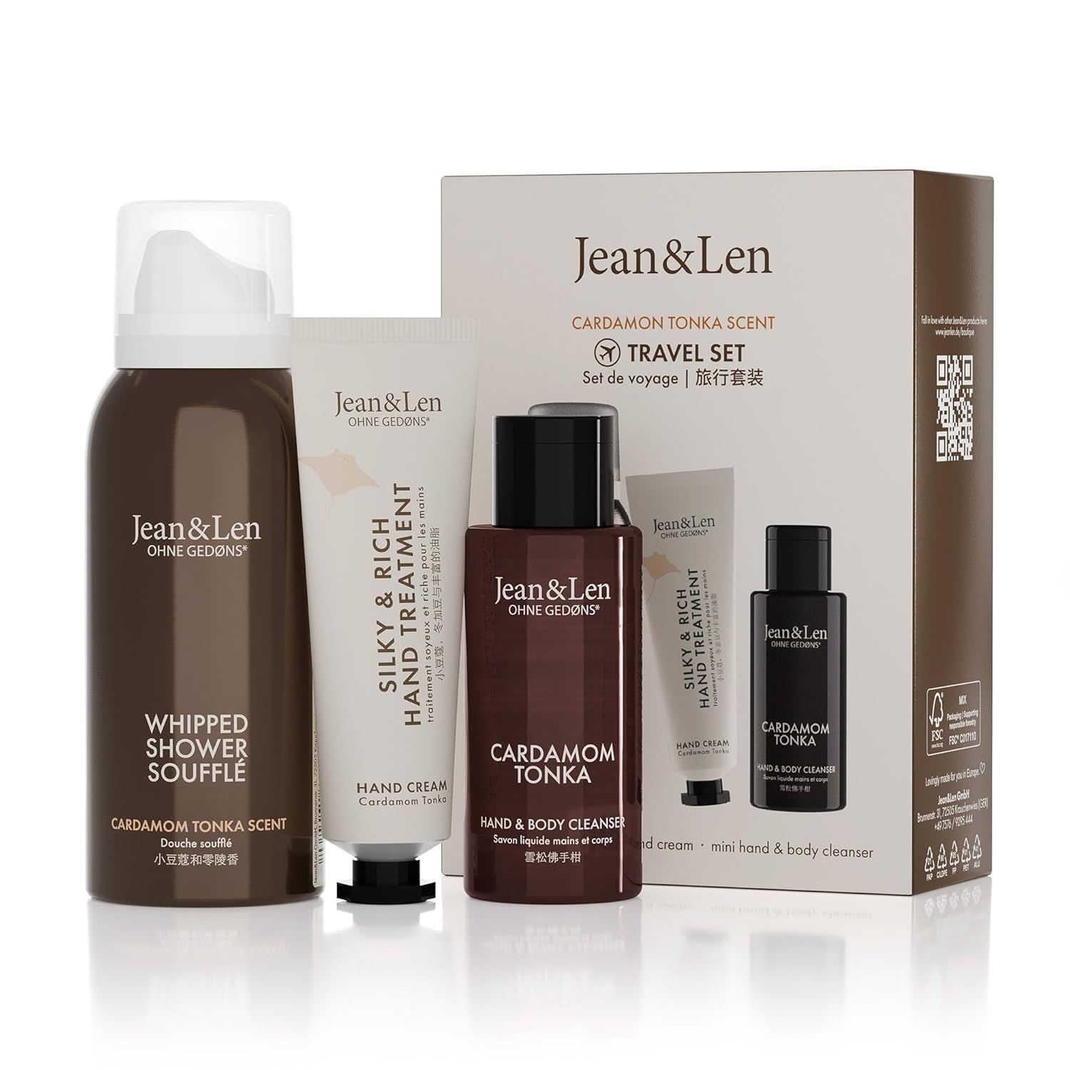 Reiseset mit Duschschaum, Handcreme und Hand- & Body Cleanser. Verpackung mit Produktnamen und Logo. Flaschen und Tube in Braun und Weiß.