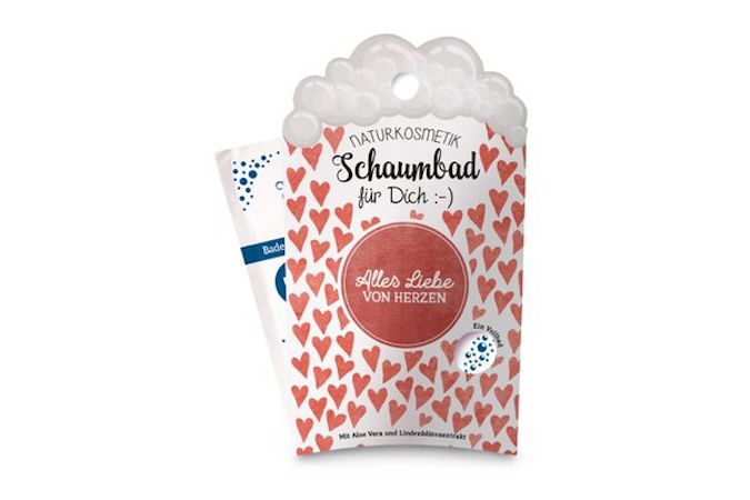 Emballage de bain moussant, motif cœurs rouges, texte : Tout l'amour du cœur. Cosmétiques naturels.