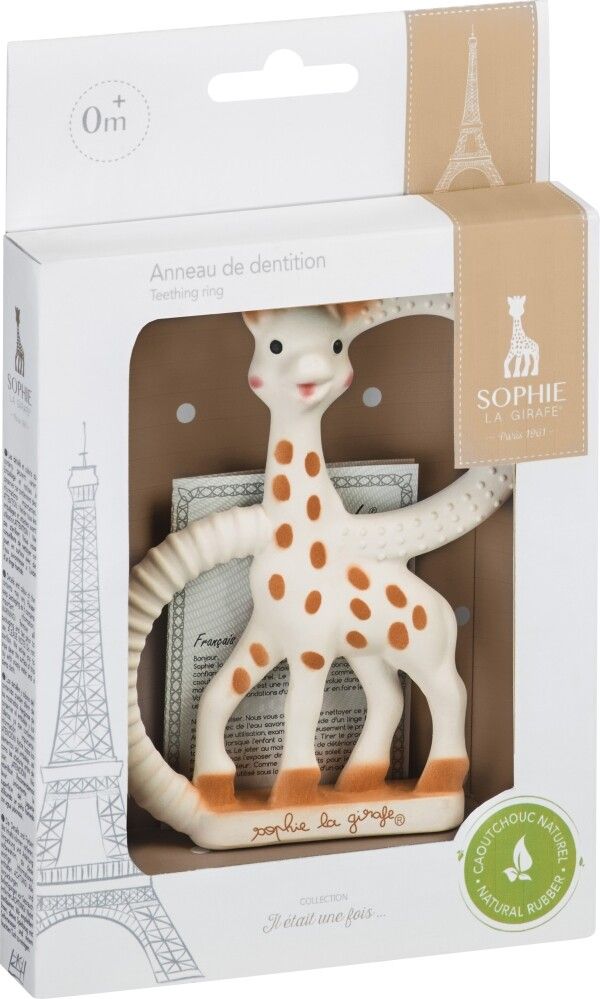 Zahnring in Verpackung. Giraffenform, weiß mit braunen Flecken. Marke: Sophie la girafe. Verpackung mit Text und Logo.