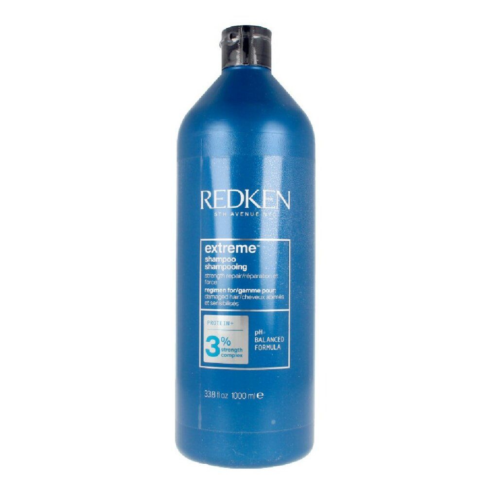 Blaue Flasche Redken Extreme Shampoo. Schwarzer Deckel. Text: Extreme Shampoo, pH-ausgewogene Formel, 1000 ml.