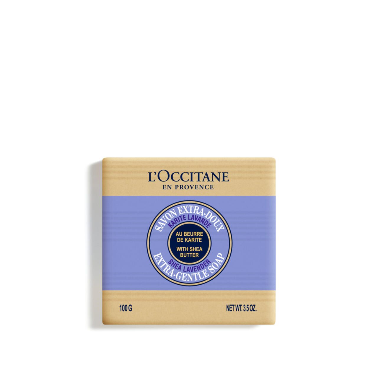 Rechteckige Seife mit lila Band. Aufschrift: L'Occitane, Savon Extra-Doux Karité Lavande, Shea Lavender. 100g, Net Wt. 3.5 oz.
