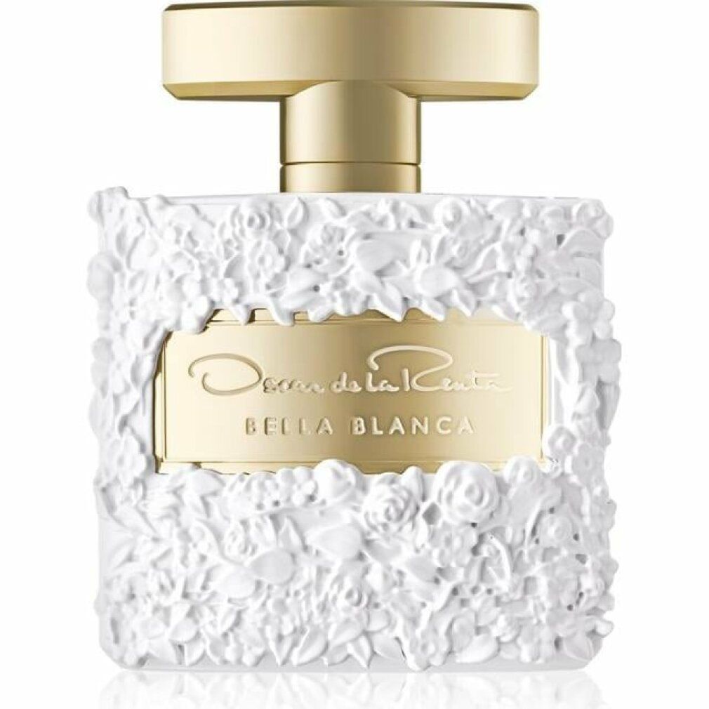 Parfümflakon mit weißem Blumendekor. Goldfarbener Verschluss. Aufschrift: Oscar de la Renta Bella Blanca.