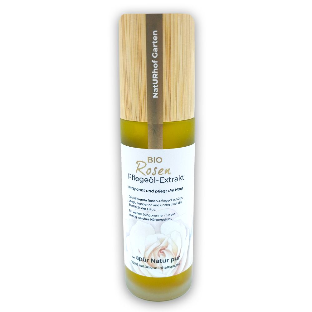 Glasflasche mit Holzdeckel. Aufschrift: BIO Rosen Pflegeöl-Extrakt. Etikett mit Rosenblüte. NatURhof Garten.