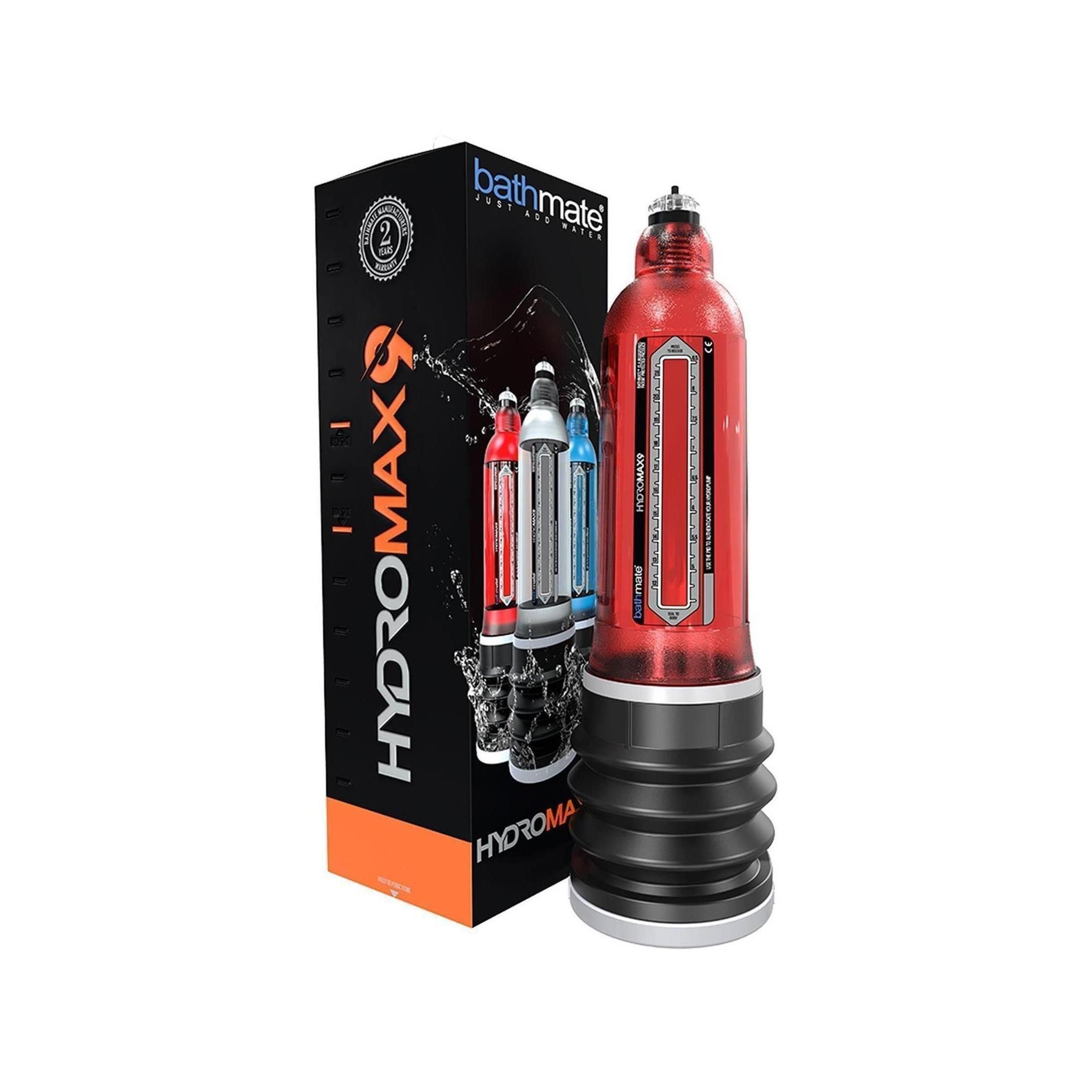 Hydromax9, roter Zylinder mit schwarzem Faltenbalg, neben Verpackung. Verpackung mit Produktabbildung und Schriftzug.