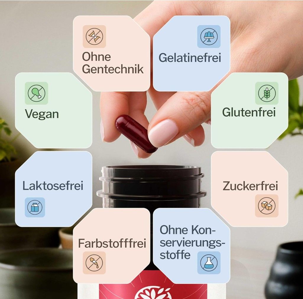 Hand hält Kapsel über Produktflasche. Text: Ohne Gentechnik, Gelatinefrei, Glutenfrei, Laktosefrei, Zuckerfrei, Farbstofffrei.