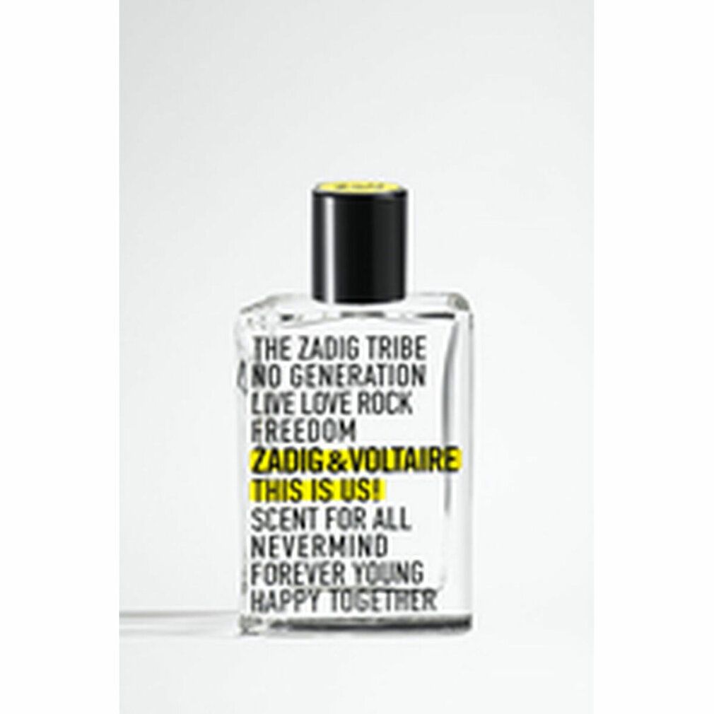 Klarer Flakon mit schwarzem Verschluss. Aufschrift: Zadig & Voltaire This is Us! Gelbe Akzente.