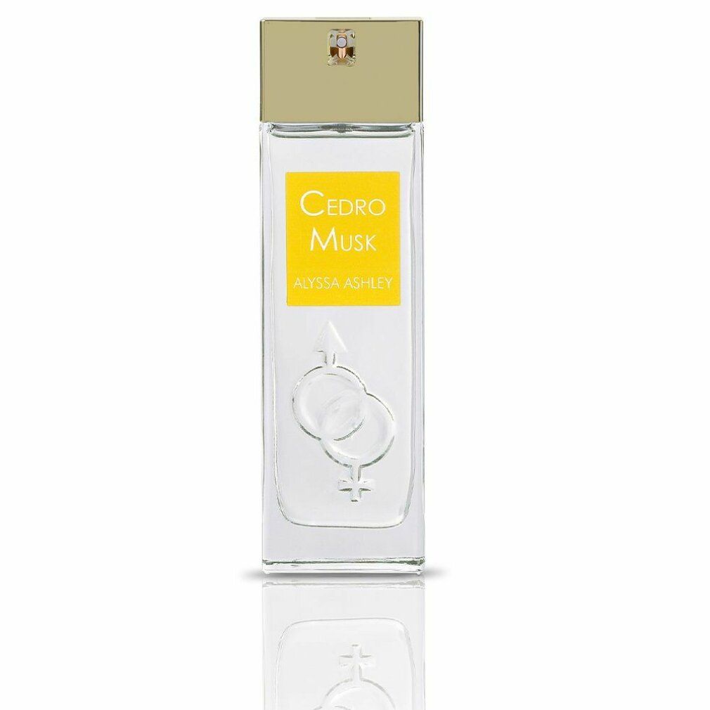 Alyssa Ashley Cedro Musk Eau de Parfum Spray. Rechteckige Glasflasche mit gelbem Etikett. Goldfarbener Deckel. Geschlechter-Symbol.