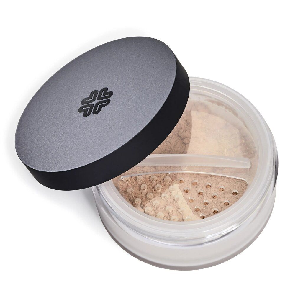 Offene Dose Mineral-Make-up. Grauer Deckel mit Logo. Durchsichtiger Behälter mit Inhalt in verschiedenen Farbtönen.