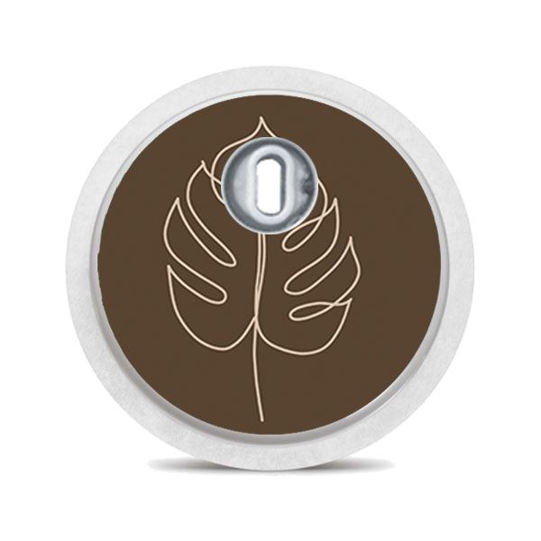 Runder Aufkleber mit Blattmuster. Brauner Hintergrund, beiges Blatt. Für FreeStyle Libre 3.