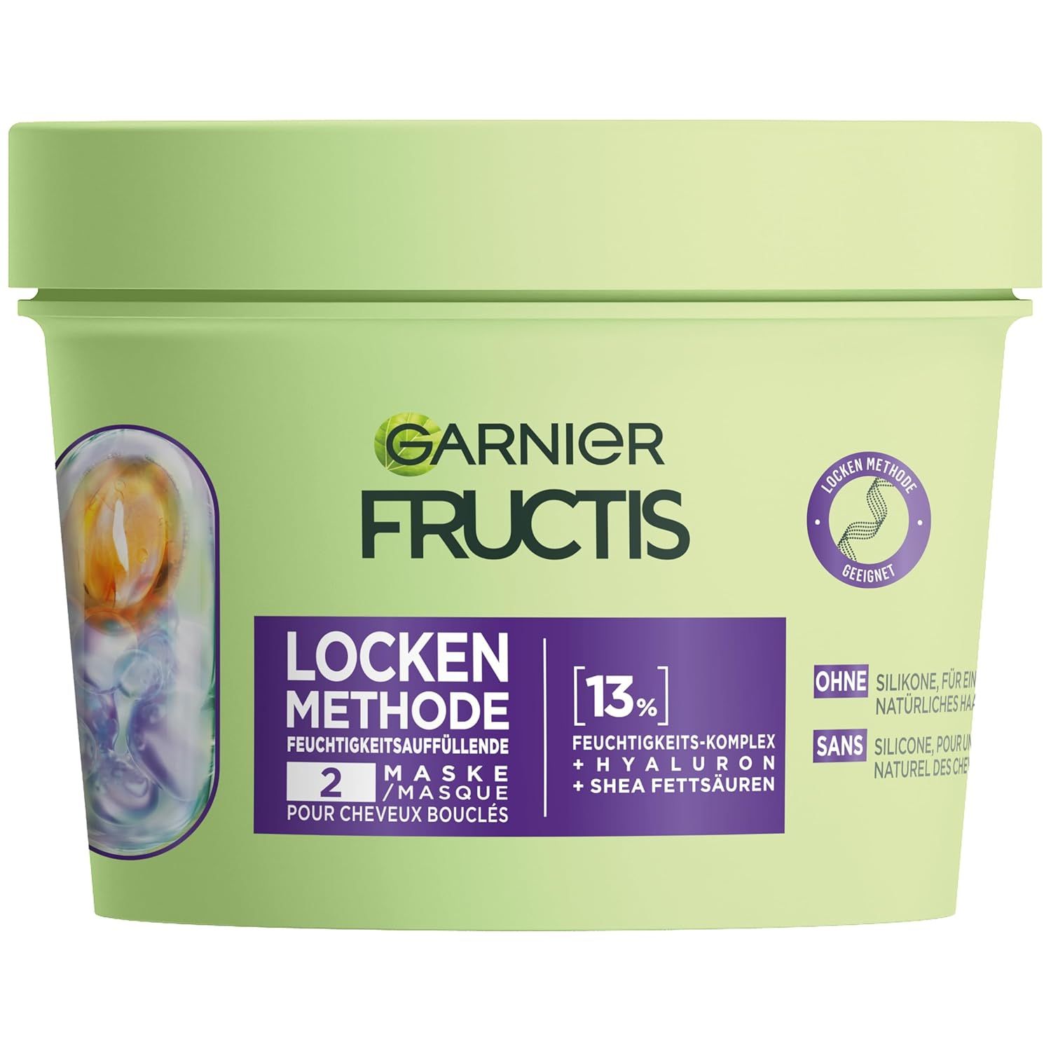 Grüne Garnier Fructis Locken Methode Haarmaske. Aufschrift: Locken Methode, 2 Maske, 13% Feuchtigkeits-Komplex + Hyaluron + Shea Fettsäuren.