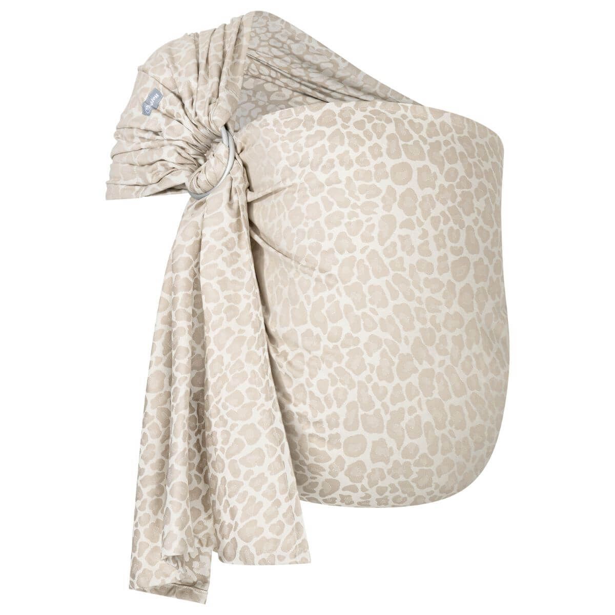 Ring-Sling kbA. Beige Stoff mit hellem Muster. Metallring. Stoff gefaltet.