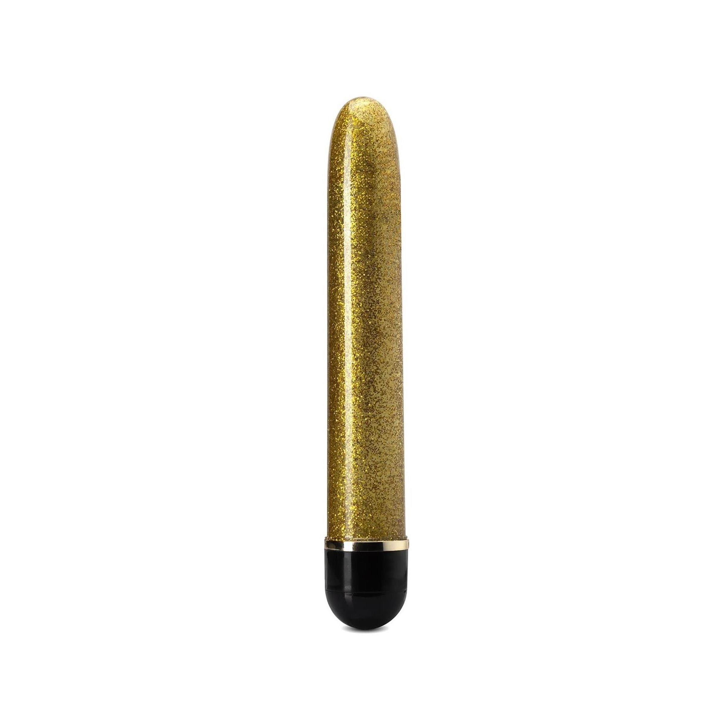 Goldfarbener Vibrator mit schwarzem Ende. Zylindrische Form mit glitzernder Oberfläche.