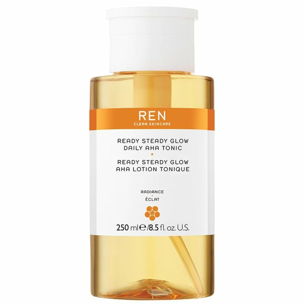 Flasche mit weißem Deckel und Pumpe. Aufkleber mit Text: REN, Ready Steady Glow Daily AHA Tonic. Orangefarbener Streifen.