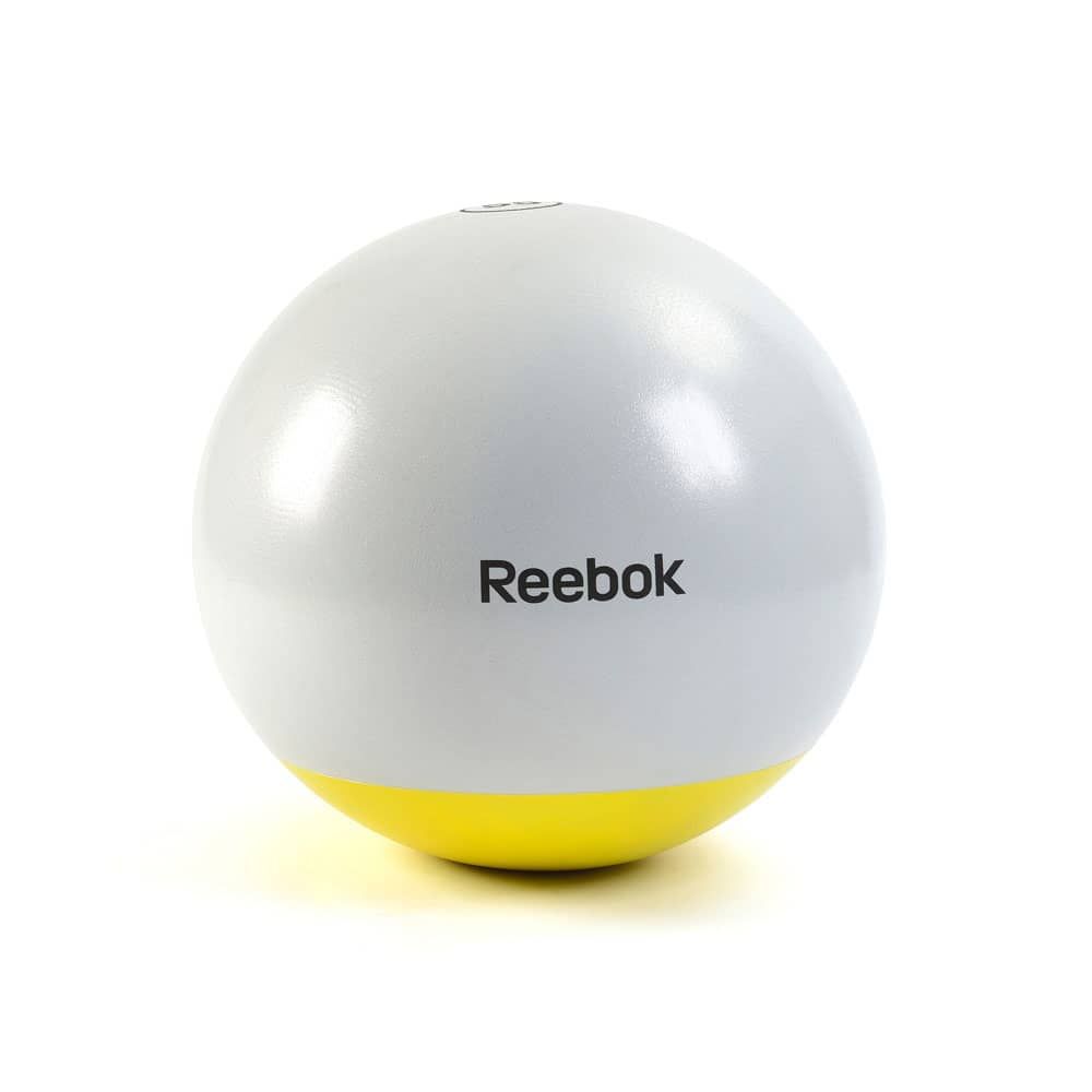 Gymnastikball, weiß-gelb, mit Reebok-Logo. Der Ball ist rund.