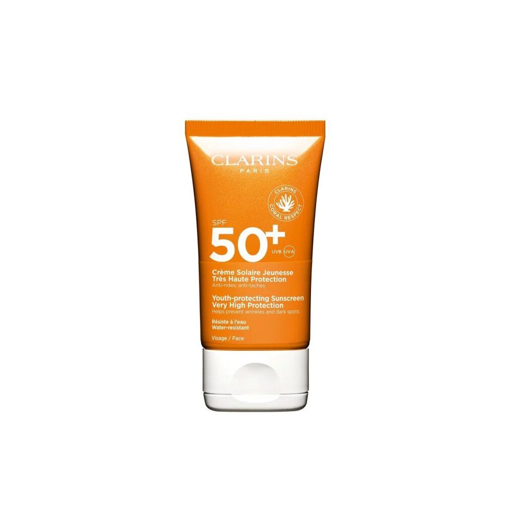 Clarins Sonnencreme mit LSF 50+ für das Gesicht. Orange Tube mit weißem Verschluss.