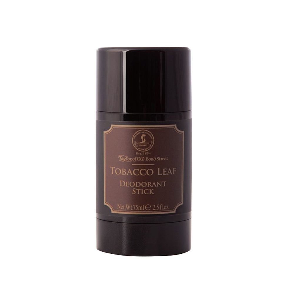 Dunkler Deostick mit braunem Etikett, "Tobacco Leaf Deodorant Stick" Aufschrift.