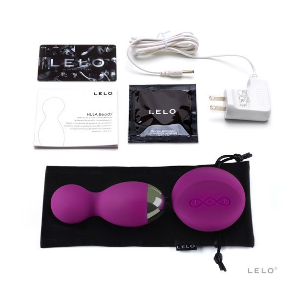Schwarze Verpackung mit lila Vibrator und Fernbedienung. Text: LELO, HULA Beads.