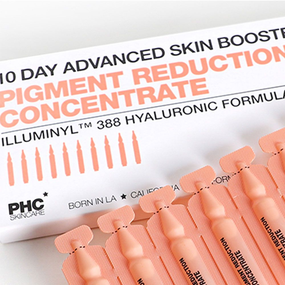 Verpackung mit Ampullen. Aufschrift: 'PIGMENT REDUCTION CONCENTRATE' und 'PHC'.